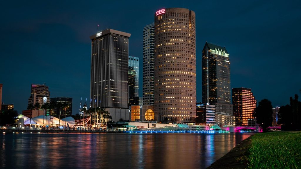 Night view of a city skyline in Tampa Florida over a river