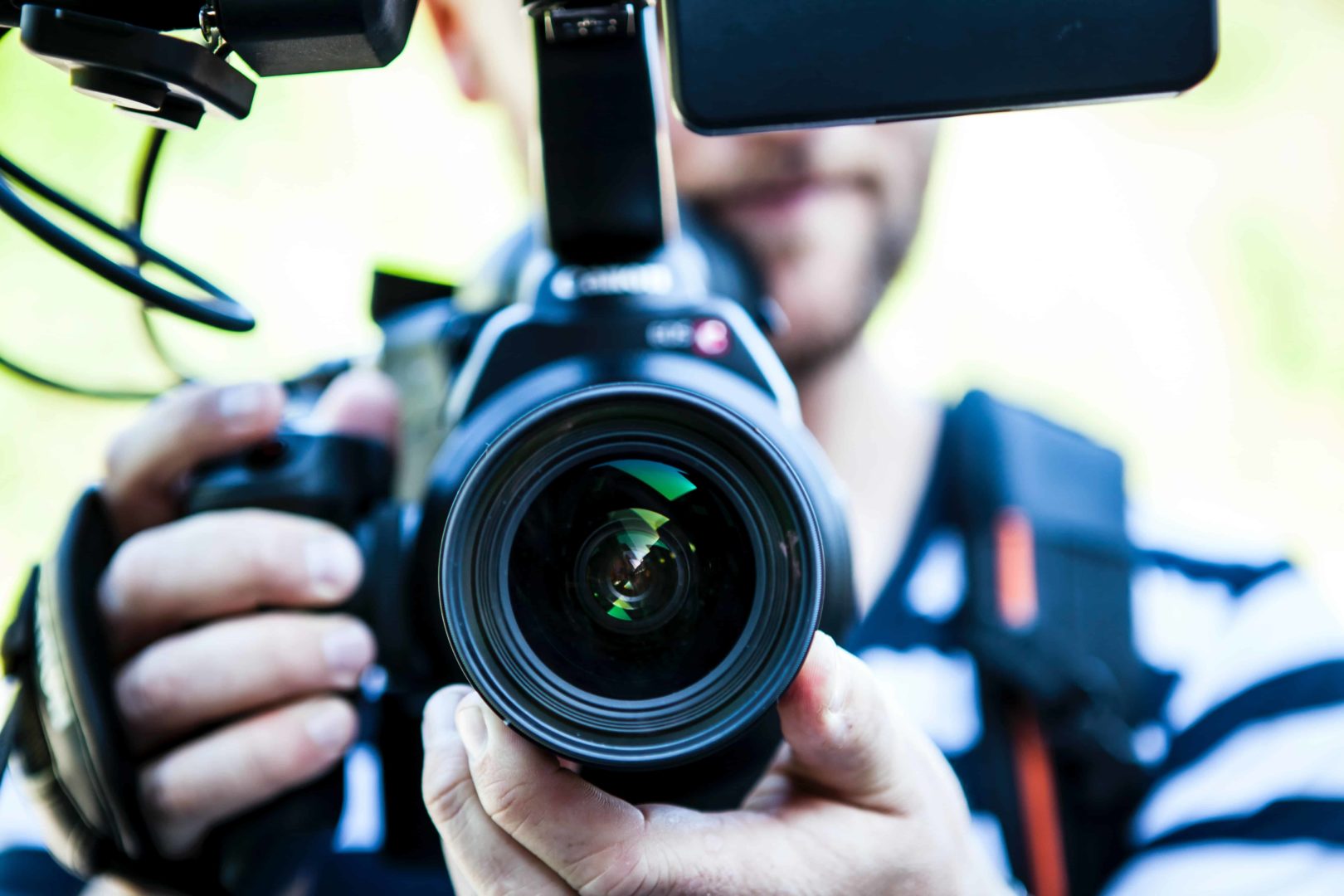 A man holds a camera