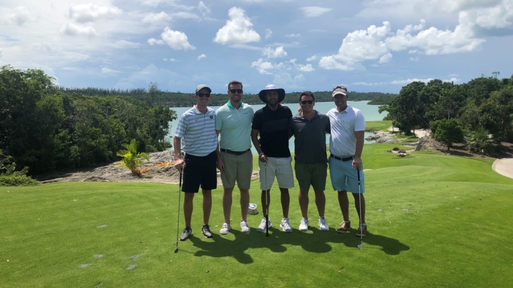 Acquisitions team golfing in the Bahamas