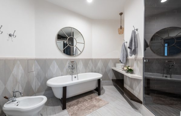 A renovated bathroom with garden tub and luxury tiles