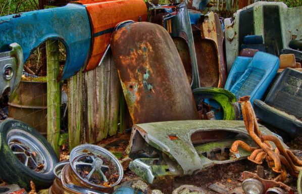 Junk cars and rusted metal when trying to sell a house with code violations in Jacksonville