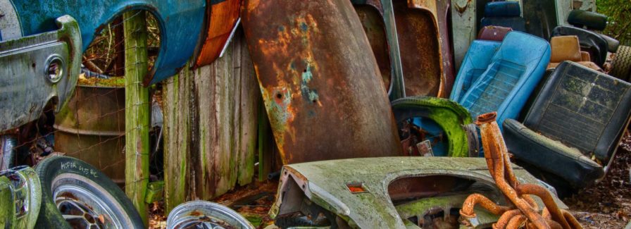 Junk cars and rusted metal when trying to sell a house with code violations in Jacksonville