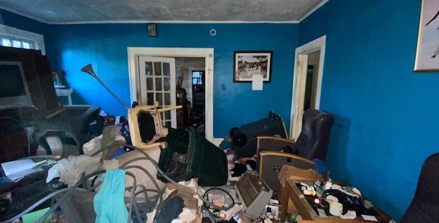 How to sell a hoarder house in Jacksonville. Living room of a hoarder house sold in Jacksonville, Florida.